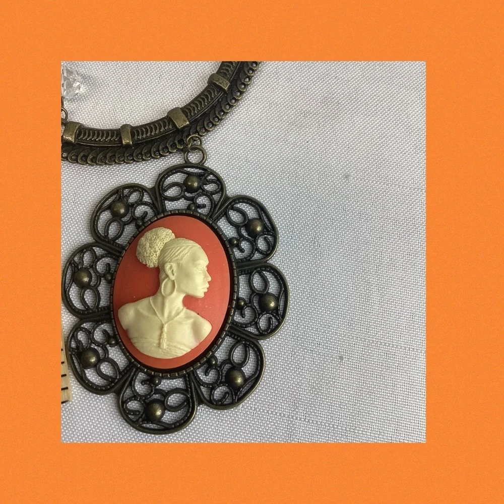 Orange and bronze cameo necklace.